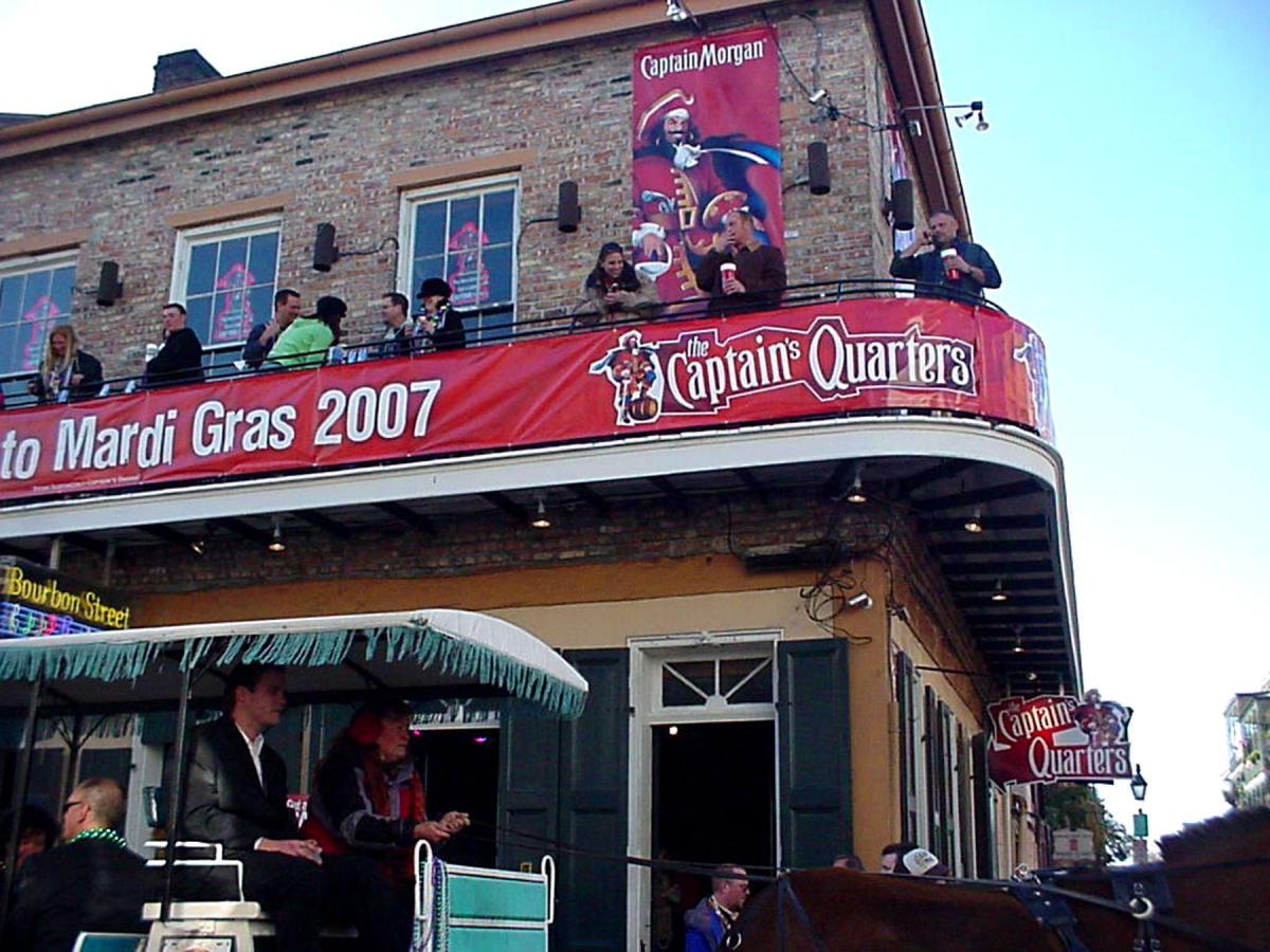 Banners installed Bourbon Street New Orleans for Captain Morgan Mardi Gras party